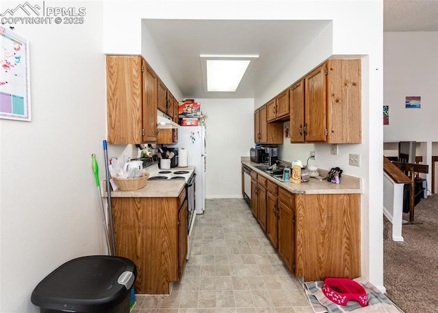 997 Magnolia St, Colorado Springs, CO 80907 - kitchen with black microwave, under cabinet range hood, dishwasher, light countertops, and electric range