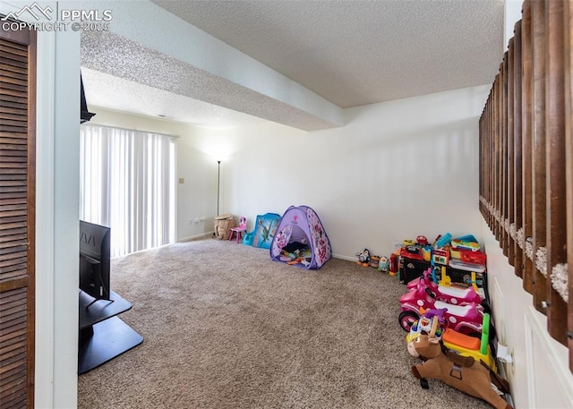 997 Magnolia St, Colorado Springs, CO 80907 - game room featuring carpet flooring and a textured ceiling