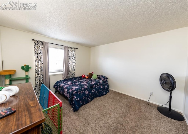 997 Magnolia St, Colorado Springs, CO 80907 - bedroom with a textured ceiling, baseboards, and carpet floors