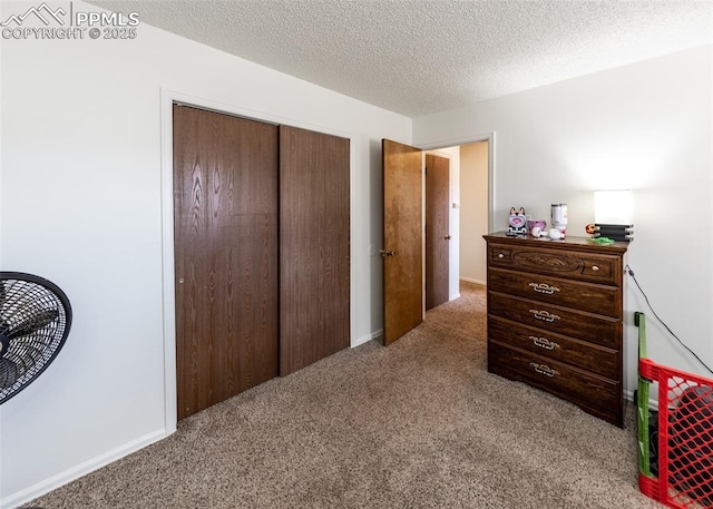 997 Magnolia St, Colorado Springs, CO 80907 - carpeted bedroom with a closet and a textured ceiling