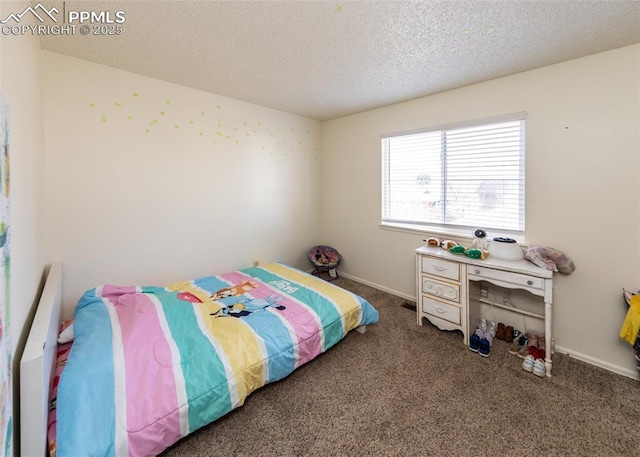997 Magnolia St, Colorado Springs, CO 80907 - bedroom with a textured ceiling, baseboards, and carpet floors