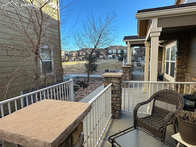 balcony featuring a residential view