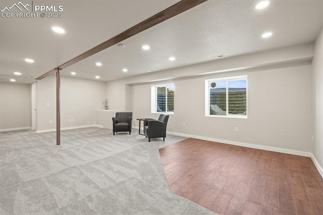 unfurnished room with recessed lighting, wood finished floors, and baseboards