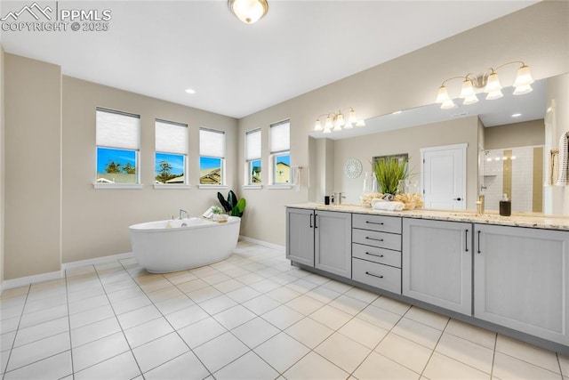 full bath with double vanity, baseboards, tile patterned floors, a freestanding bath, and a shower stall