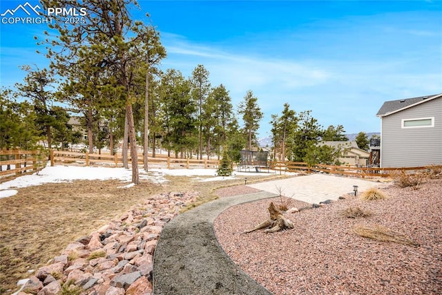 view of yard featuring a patio area and fence