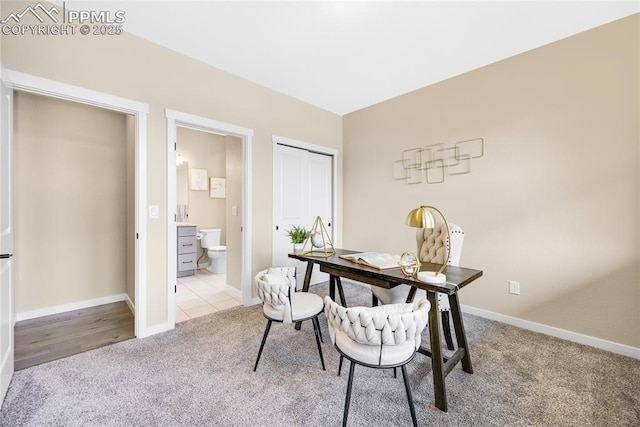 home office featuring baseboards and carpet flooring