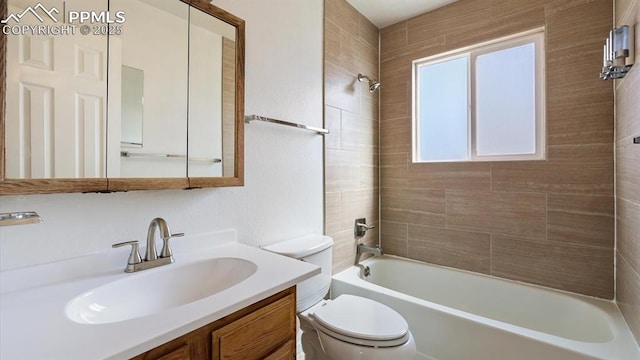 bathroom featuring vanity, bathing tub / shower combination, and toilet