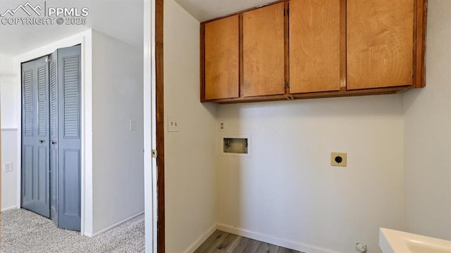 clothes washing area featuring hookup for a washing machine, cabinet space, baseboards, and hookup for an electric dryer