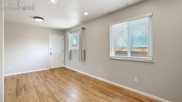 entrance foyer with recessed lighting, wood finished floors, and baseboards