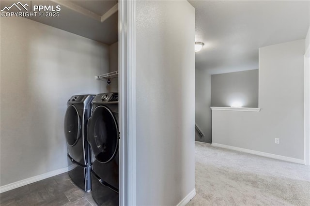 washroom with laundry area, independent washer and dryer, carpet, and baseboards