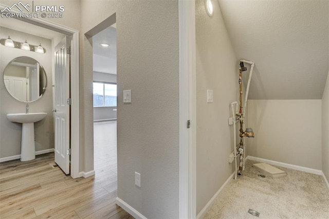 bathroom featuring wood finished floors and baseboards