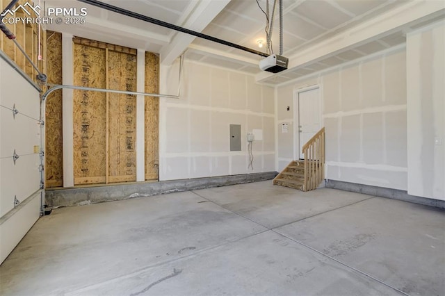 garage featuring electric panel and a garage door opener