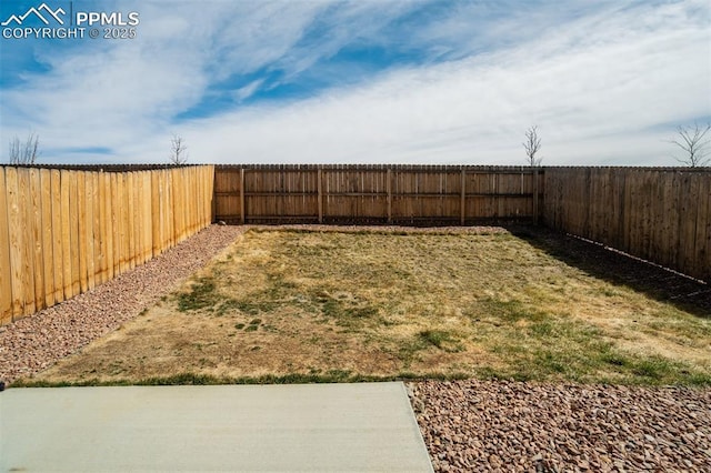 view of yard with a fenced backyard