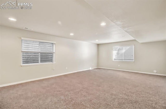 carpeted spare room with recessed lighting, visible vents, and baseboards