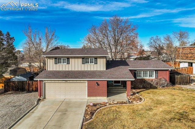 traditional home with concrete driveway, fence, a front lawn, board and batten siding, and brick siding