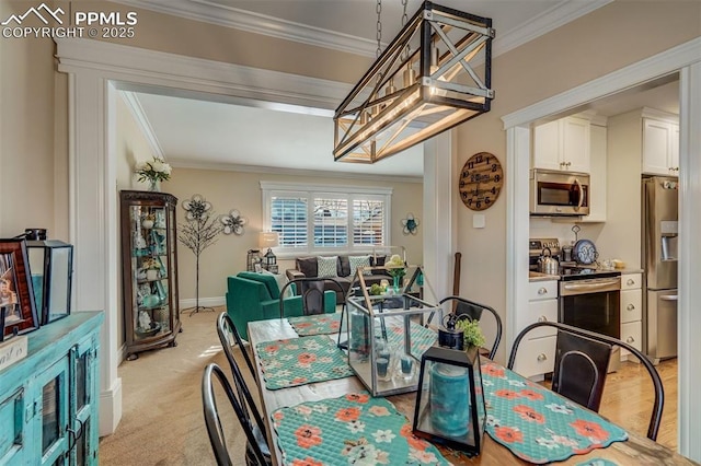 dining area with light carpet, crown molding, and baseboards