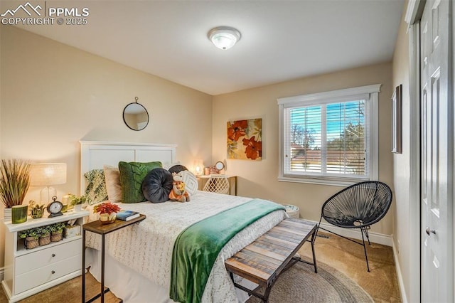 bedroom with carpet flooring and baseboards