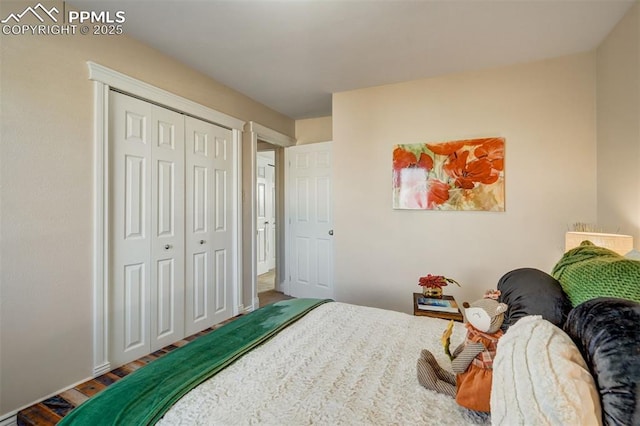 bedroom featuring a closet and wood finished floors