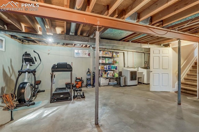 unfinished basement with independent washer and dryer and stairs