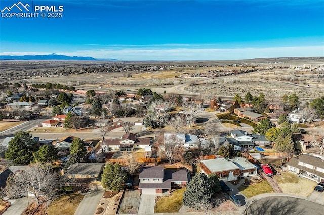 aerial view featuring a residential view and a mountain view