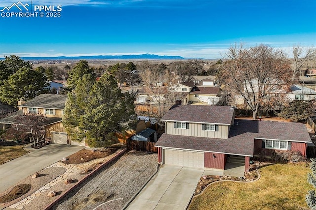 birds eye view of property featuring a residential view and a mountain view