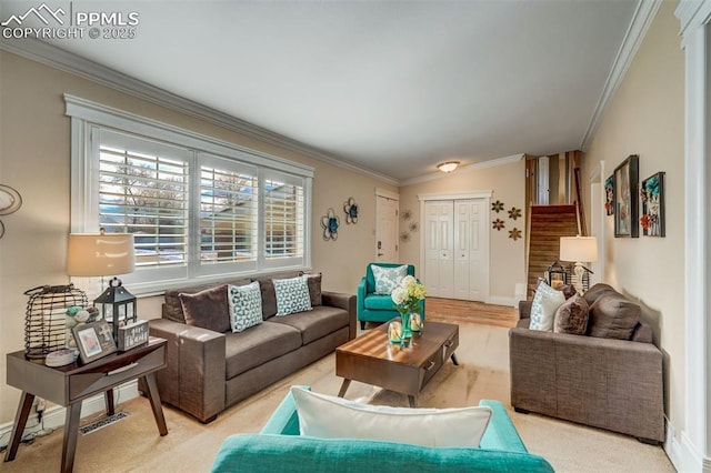 living room with ornamental molding, stairway, and baseboards