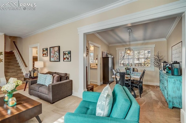 living area with light carpet, ornamental molding, stairs, and baseboards