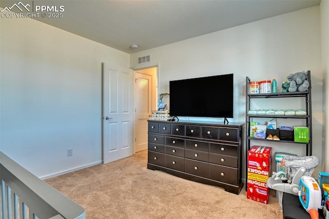 bedroom featuring carpet floors, visible vents, and baseboards