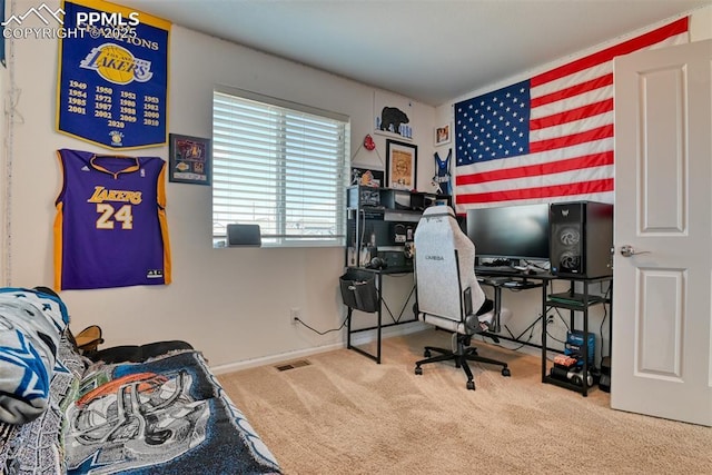 carpeted bedroom featuring baseboards and visible vents