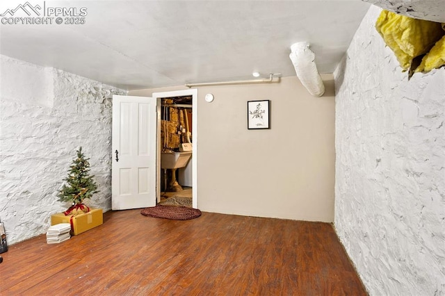 unfurnished room with wood finished floors