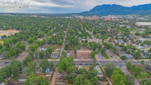 drone / aerial view featuring a residential view and a mountain view