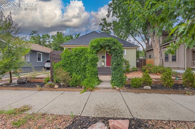 view of front of house with fence