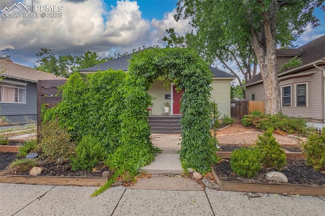 obstructed view of property featuring fence
