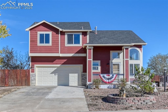 704 Pioneer Ln, Florence, CO 81226 - view of front facade featuring a garage, covered porch, driveway, and fence