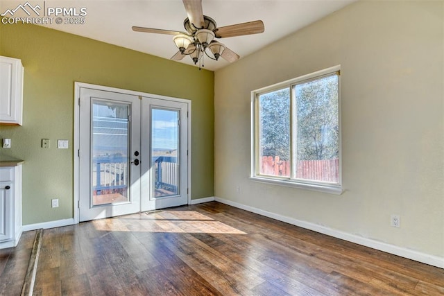 doorway with a ceiling fan, french doors, baseboards, and wood finished floors