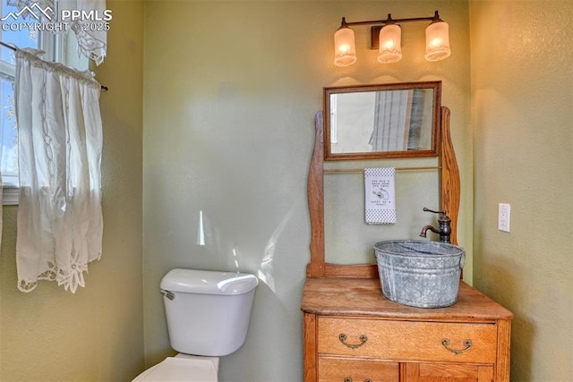 bathroom with vanity and toilet