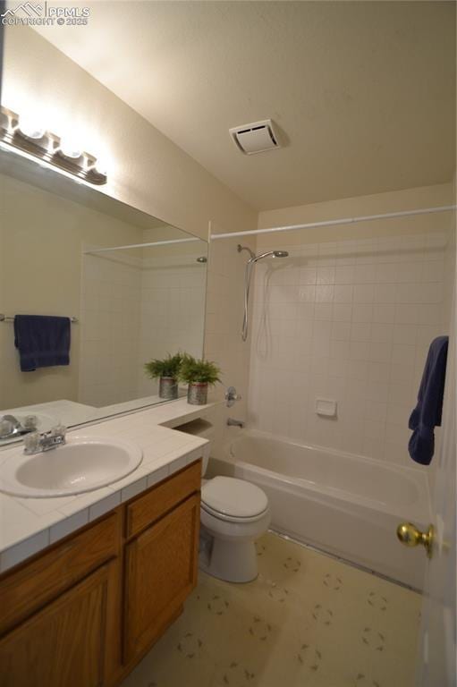 bathroom featuring toilet, washtub / shower combination, vanity, and visible vents