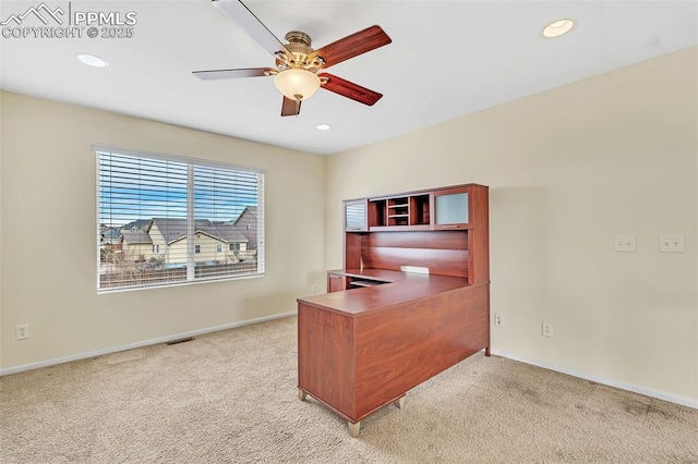 office with light carpet and recessed lighting