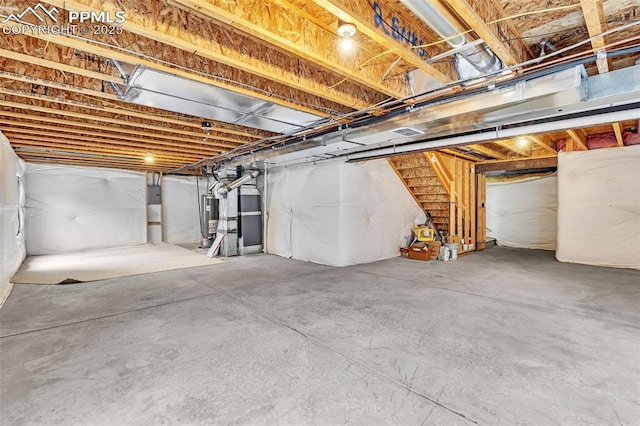 unfinished basement with water heater