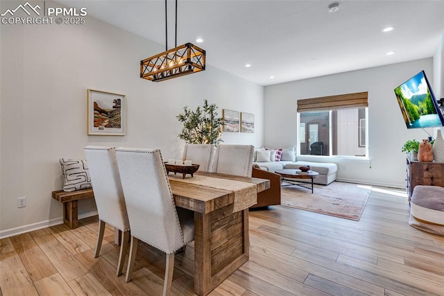 dining area featuring recessed lighting, light wood-type flooring, and baseboards