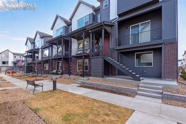 exterior space featuring a residential view and stairs