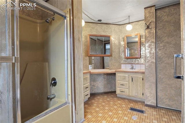 full bath with visible vents, vanity, shower / tub combination, and wallpapered walls