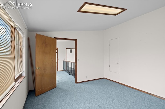 bedroom with carpet floors and baseboards