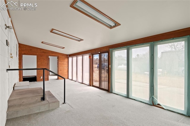 unfurnished sunroom featuring lofted ceiling