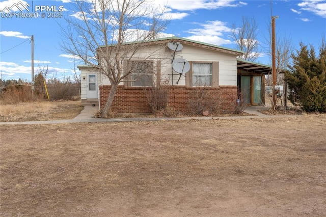 view of front of home with brick siding