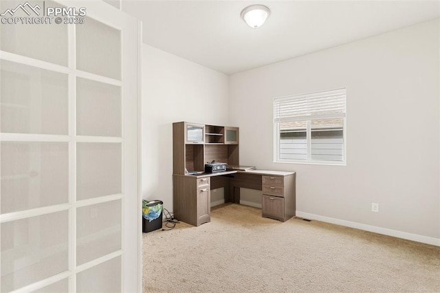 office area with baseboards and light colored carpet