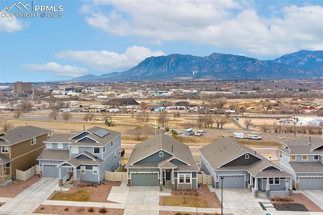 drone / aerial view with a mountain view and a residential view