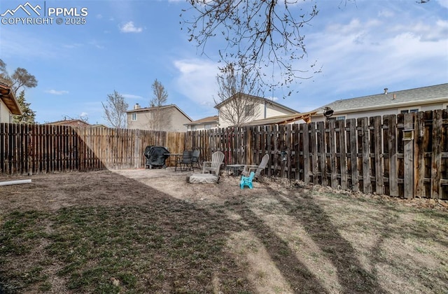 view of yard with a patio and a fenced backyard