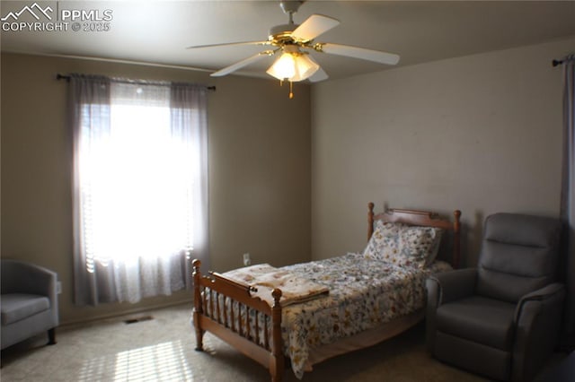 carpeted bedroom featuring a ceiling fan