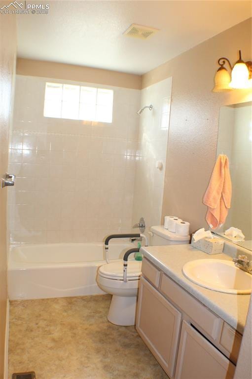 full bath with visible vents, vanity, toilet, and shower / bathtub combination